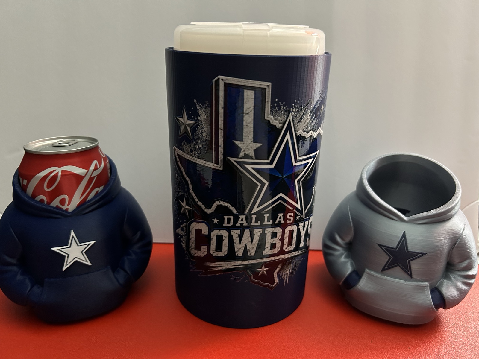 Hoodie can coolers beside a matching wipes canister cover